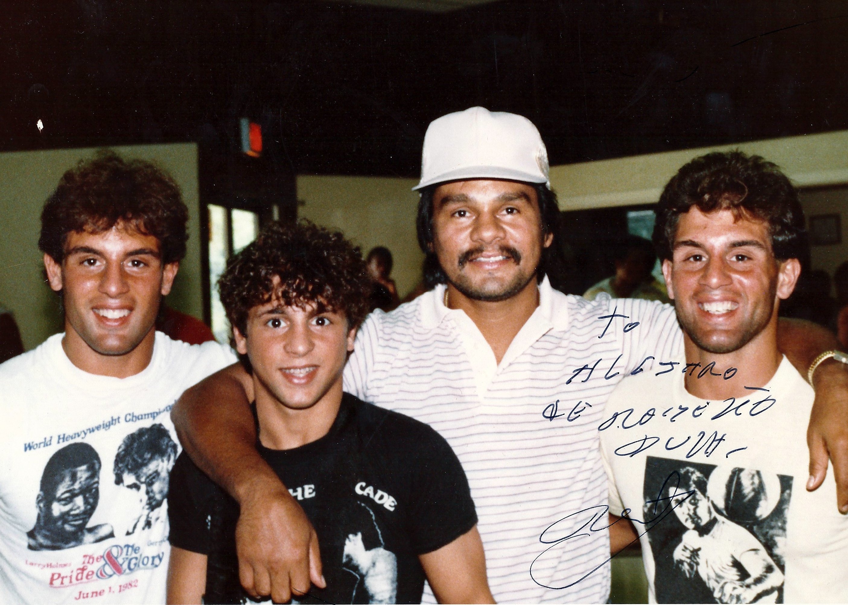 Roberto Duran surrounded by Alex, Gerard, and John Rinaldi in 1982