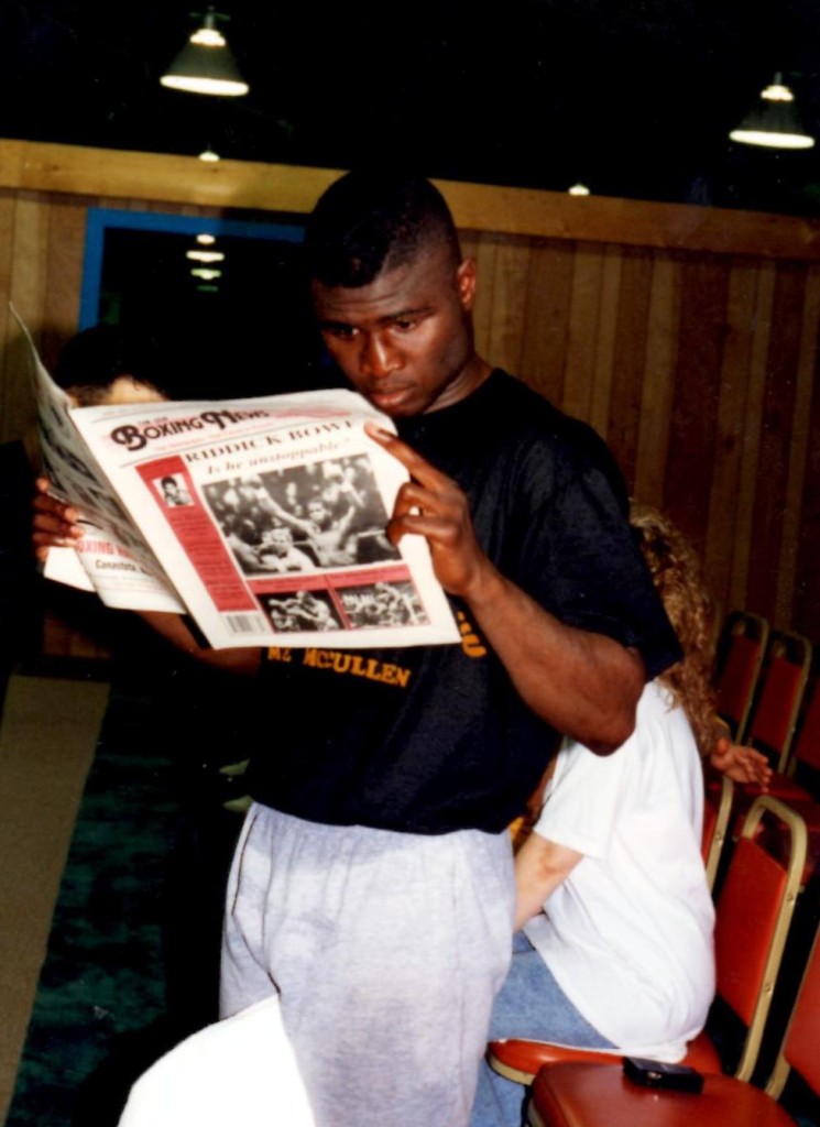 Super Middleweight Champion James "Lights Out" Toney reading the USA Boxing News