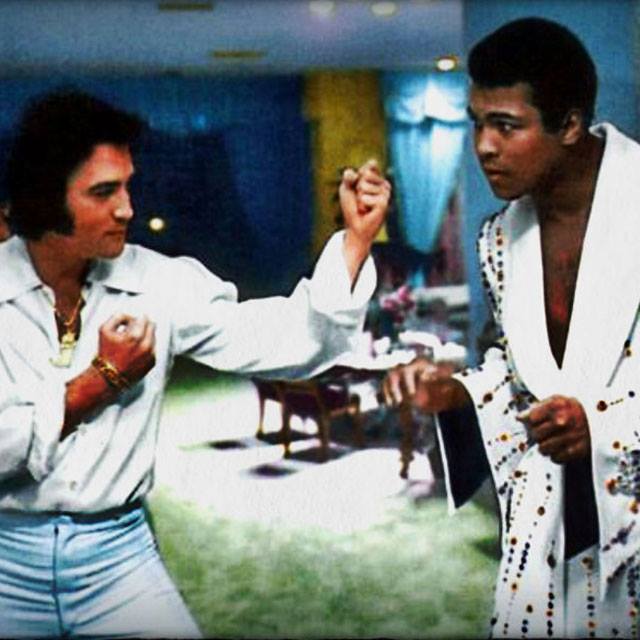 Elvis Presley squares off with Muhammad Ali who is wearing the robe that Elvis had made for him before his bout with Joe Bugner