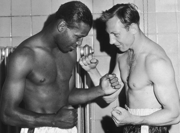 9th August 1950: Boxers Sugar Ray Robinson (1921 - 1989)(L) and Charlie Fusari assume a fighting pose after weighing in at Roosevelt Stadium, Jersey City, New Jersey. The proceeds from the fight went to charity. (Photo by New York Times Co./Getty Images)