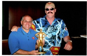 John Rinaldi presented with the George Reeves Superman Award by Jim Hambrick in 2006.