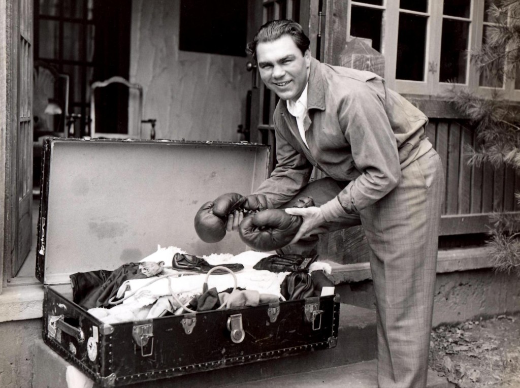 May 2, 1936. Former Heavyweight champion Max Schmeling unpacking his boxing gear after arriving at his training camp at the Na[anoch Country Cl;ub in Napanoch, New York to begin training and preparation for his upcoming June bout at Yankee Stadium against unbeaten Joe Louis.