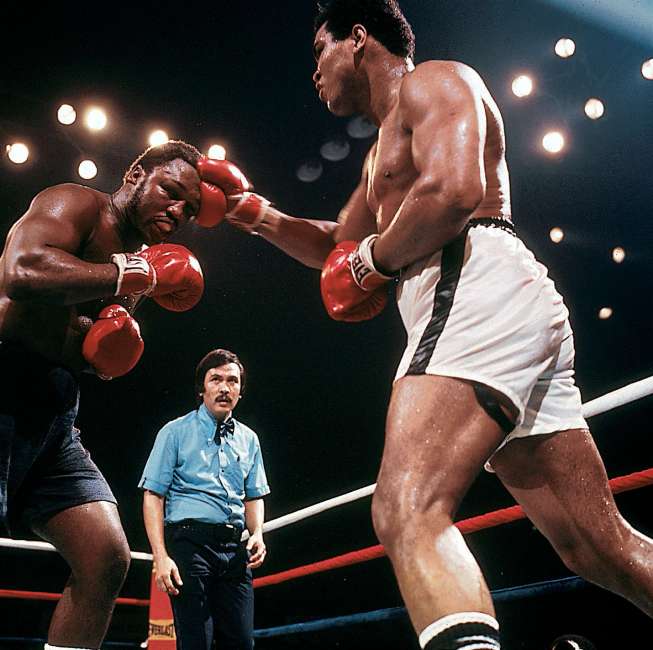 10/01/75 Muhammad Ali vs. Joe Frazier - Araheta Coliseum, Quezon City, Manila Phillippines. Ali lands a right hand to the head of Joe Frazier during the third of their three bouts. Ali won on a 15 round KO. Credit: Neil Leifer SetNumber: X19895
