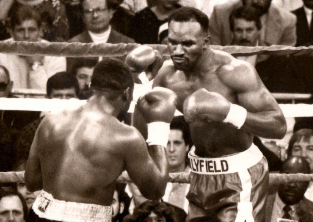 Evander Holyfield (R) vs. Smokin' Bert Cooper in 1991. Holyfield retained his title by TKO 7 * (PHOTO BY ALEX RINALDI)