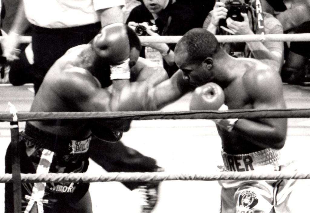 Michael Moorer (R) knocking out Bert Cooper in 1992 in Atlantic City, NJ * (PHOTO BY ALEX RINALDI)