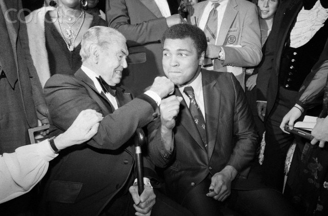 02 Feb 1981 --- Original caption: 2/2/1981-New York, NY- Jack Dempsey takes a poke at Muhammad Ali during the first Thurman Award Dinner of the Association for the Help of Retarded Children. The award, a tribute to the late Thruman Munson, in recognition of his interest in the mentally retarded, was presented to Dempsey, Ali, Billy Martin, Senator Bill Bradley, Ralph Kiner, Cliff Robertson, Ethel Kennedy, and Munson's widow, Diana. --- Image by © Bettmann/CORBIS