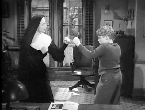  Ingrid Bergman teaching student to box in The Bells of St. Mary's.