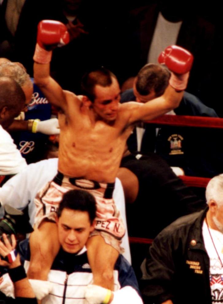  Ricardo Lopez still the IBF Light Flyweight Champion after winning his bout on September 29, 2001, in New York's Madison Square Garden,. Lopez retired after the bout with an unbelievable record of 51-0-1! (PHOTO BY ALEX RINALDI)