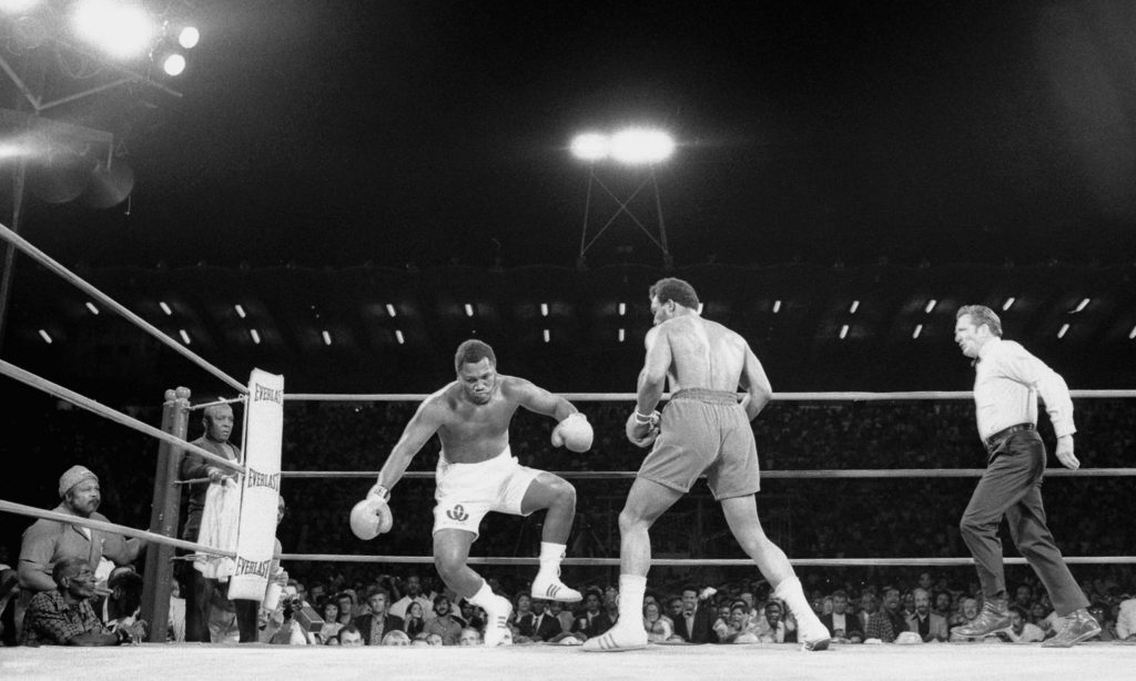 22 Jan 1973, Kingston, Jamaica --- Original caption: Joe Frazier topples backwards here during the second round of his title fight with George Foreman here on January 22nd. foreman won the fight in the second round after a series of knockdowns to take the heavyweight title away from Frazier. --- Image by © Bettmann/CORBIS