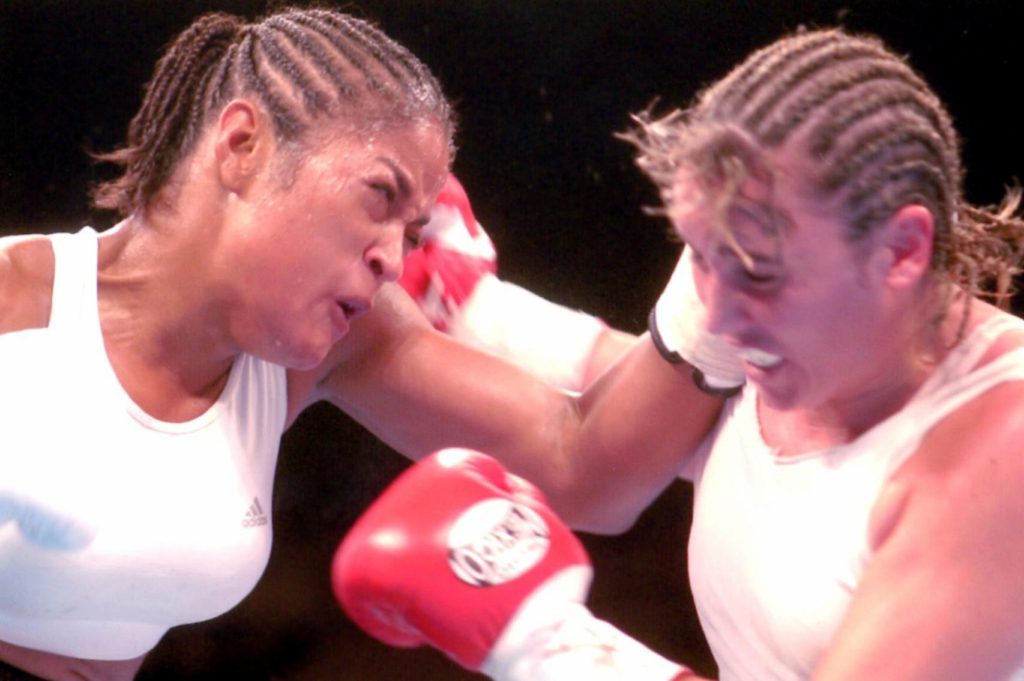 Laila Ali squaring off against Chrsity Martin on August 23, 2003. Ali won by KO 4.