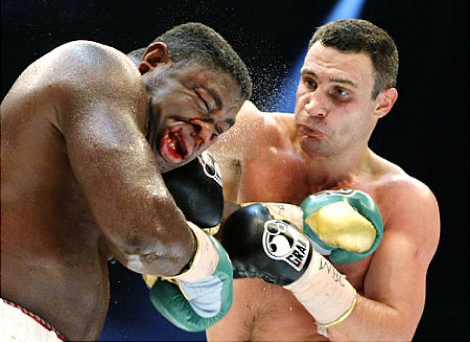 Vitali Klitschko lands a crushing right hand to the head of Samuel Peter.