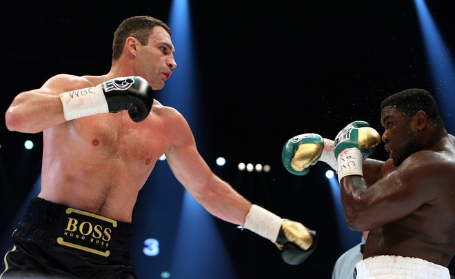 Ukrainian boxer Vitali Klitschko (L, combat name: Doctor Ironfist) exchanges punches with Nigeria's Samuel Peter (combat name: The Nigerian Nightmare) during their WBC heavyweight title fight on October 11, 2008 in Berlin. Vitali Klitschko became a world champion for the third time after beating Peter to win back the WBC heavyweight belt with a technical knock-out in the ninth round here. AFP PHOTO DDP/RONNY HARTMANN GERMANY OUT (Photo credit should read RONNY HARTMANN/AFP/Getty Images)