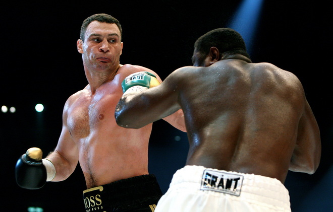 Ukrainian boxer Vitali Klitschko (L, combat name: Doctor Ironfist) exchanges punches with Nigeria's Samuel Peter (R, combat name: The Nigerian Nightmare) during their WBC heavyweight title fight on October 11, 2008 in Berlin. Vitali Klitschko became a world champion for the third time after beating Peter to win back the WBC heavyweight belt with a technical knock-out in the ninth round here. AFP PHOTO DDP/RONNY HARTMANN GERMANY OUT (Photo credit should read RONNY HARTMANN/AFP/Getty Images)