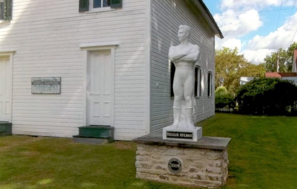 John L. Sullivan's trainer and wrestling champion William Muldoon's statue in front of The Bare Knuckle Hall of Fame.