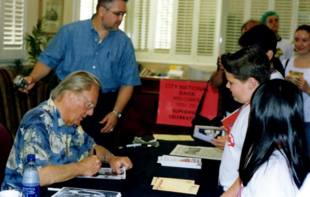 Adam West signing autographs at the Superman Celebration in Metropolis, Illinois.