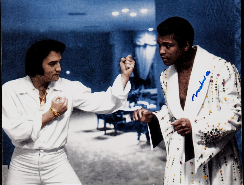 Elvis Presley L) and Muhammad Ali R) whom Elvis just surprised with a new tailored boxing robe