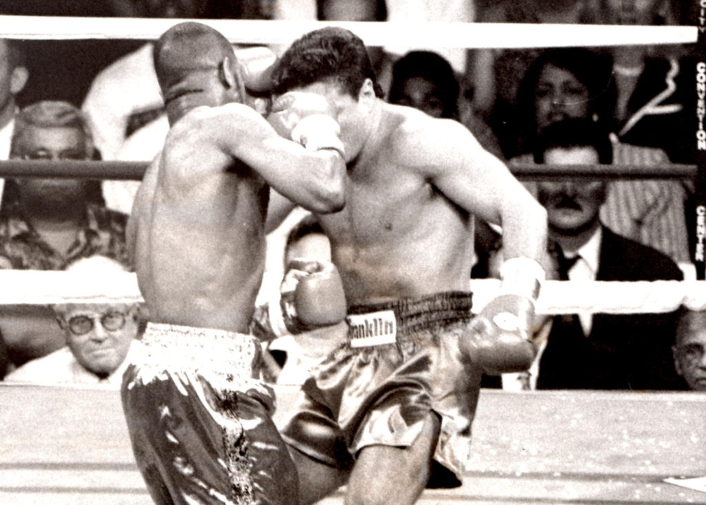 Roy Jones Jr. smashing a right into the the jaw of Vinny Pazienza