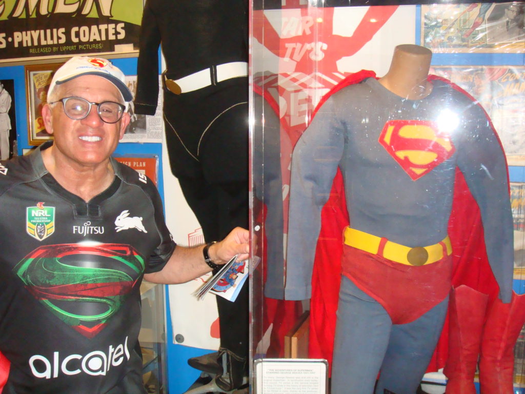 John Rinaldi vieweing the George "Superman" Reeves display in the Super Museum