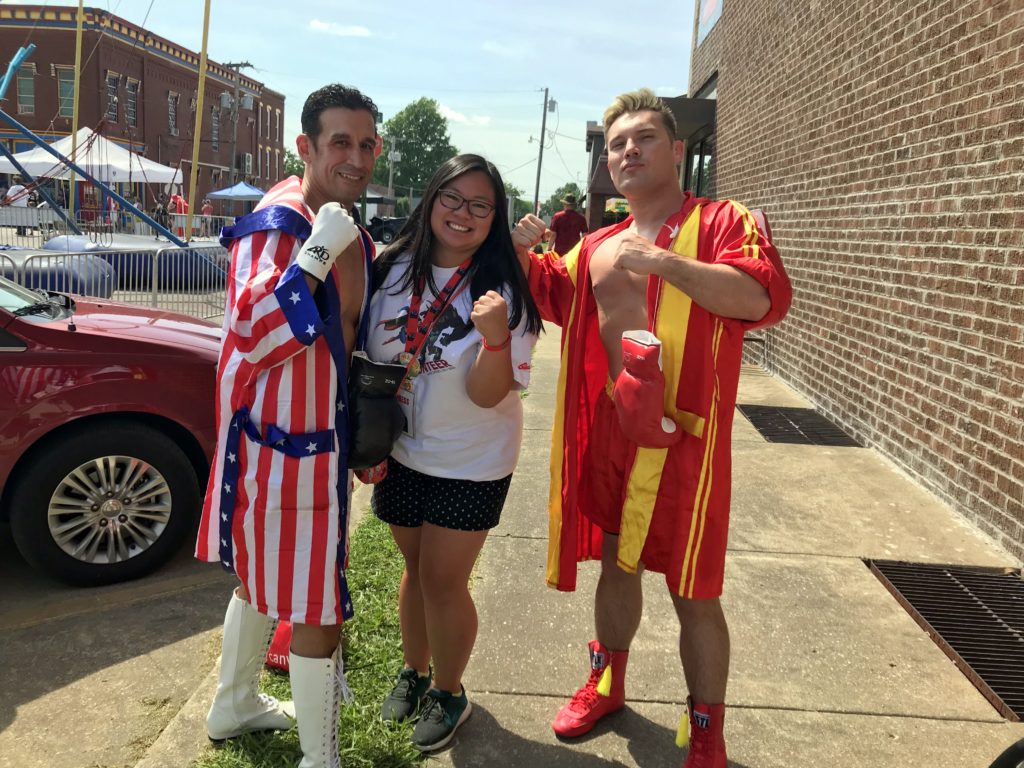 Janine Rinaldi with Ray Martinez (Rocky) and Justin Olinghouse (Drag) dressed up as characters from the Rocky IV movie