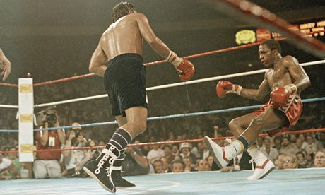 Roberto Duran (L) knocking Davey Moore (R) to the canvas in front of a packed house in Madison Square Garden.