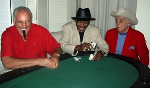 Gerry Cooney, Joe Frazier, and Jake LaMotta playing poker.