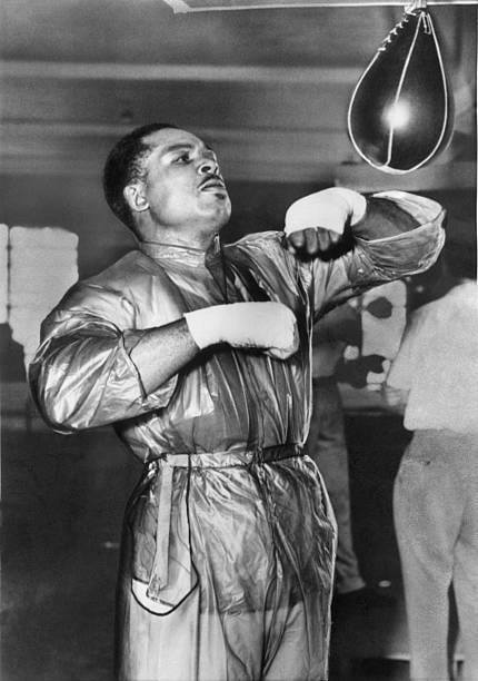 Light Heavyweight Champion Archie Moore trying to shed some pounds in training.