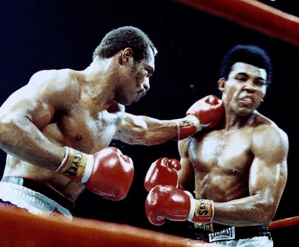 Ken Norton (L)  stabbing Muhammad Ali with a hard left jab in their second fight.