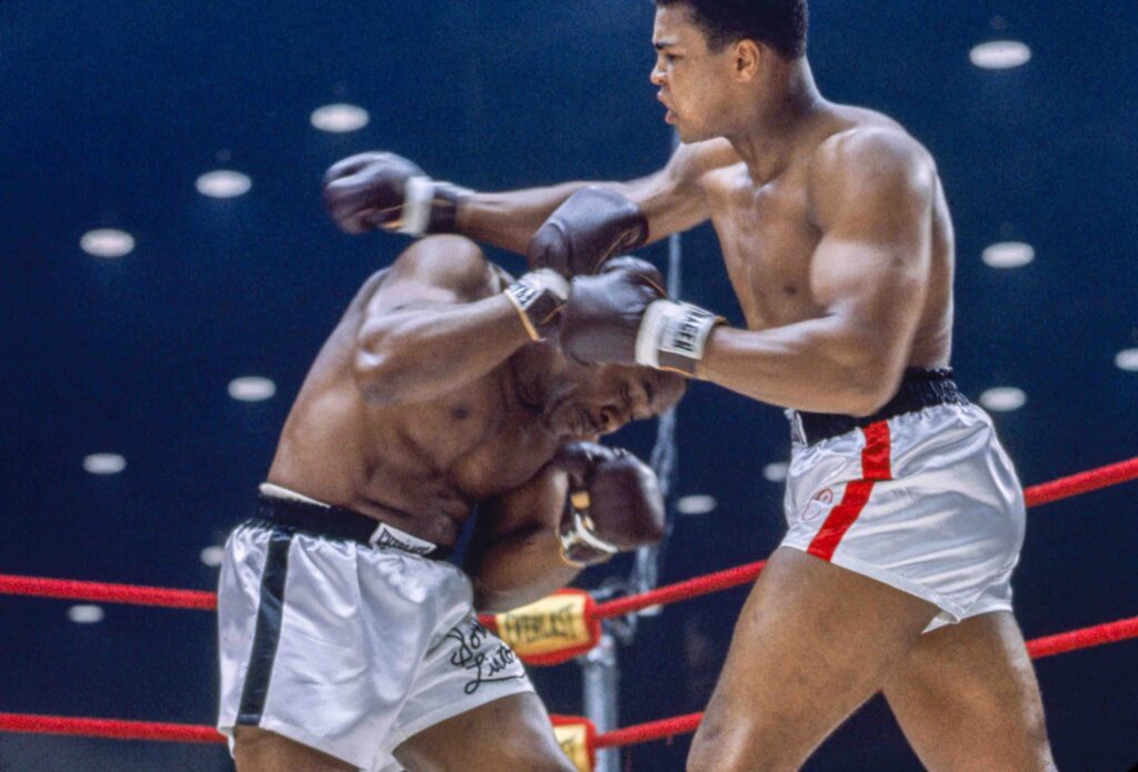 MIAMI BEACH, FL - FEBRUARY 25: Cassius Clay vs Sonny Liston at the Convention Center in Miami Beach, Florida, February 25, 1964. Cassius Clay won the World Heavyweight Title by RTD in round 6 of 15.(Photo by Stanley Weston / The Stanley Weston Archive LLC.)