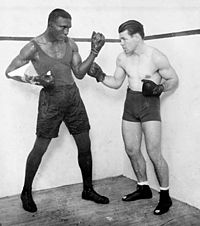 Tiger Flowers (L) and Mickey Walker (R) before their December 3, 1926 title fight at the Chicago Coliseum where Walker dethroned the Middleweight Champion Flowers to win the title.
