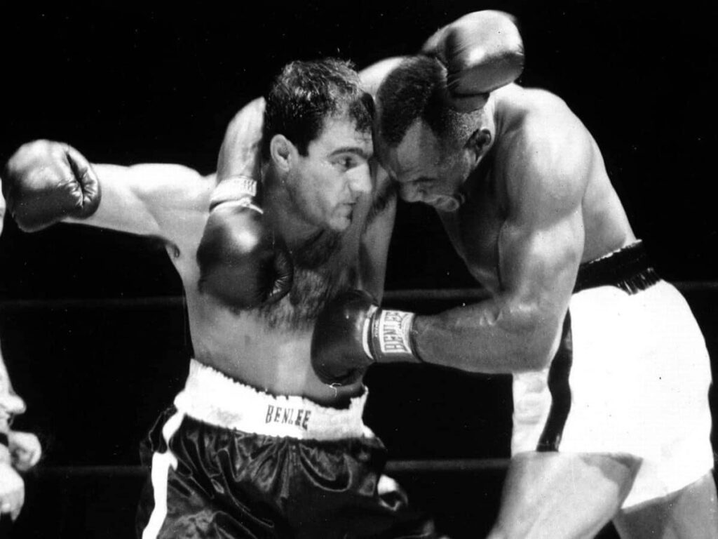 Marciano (L) and Walcott (R) fighting on the inside of the 1952 first fight.