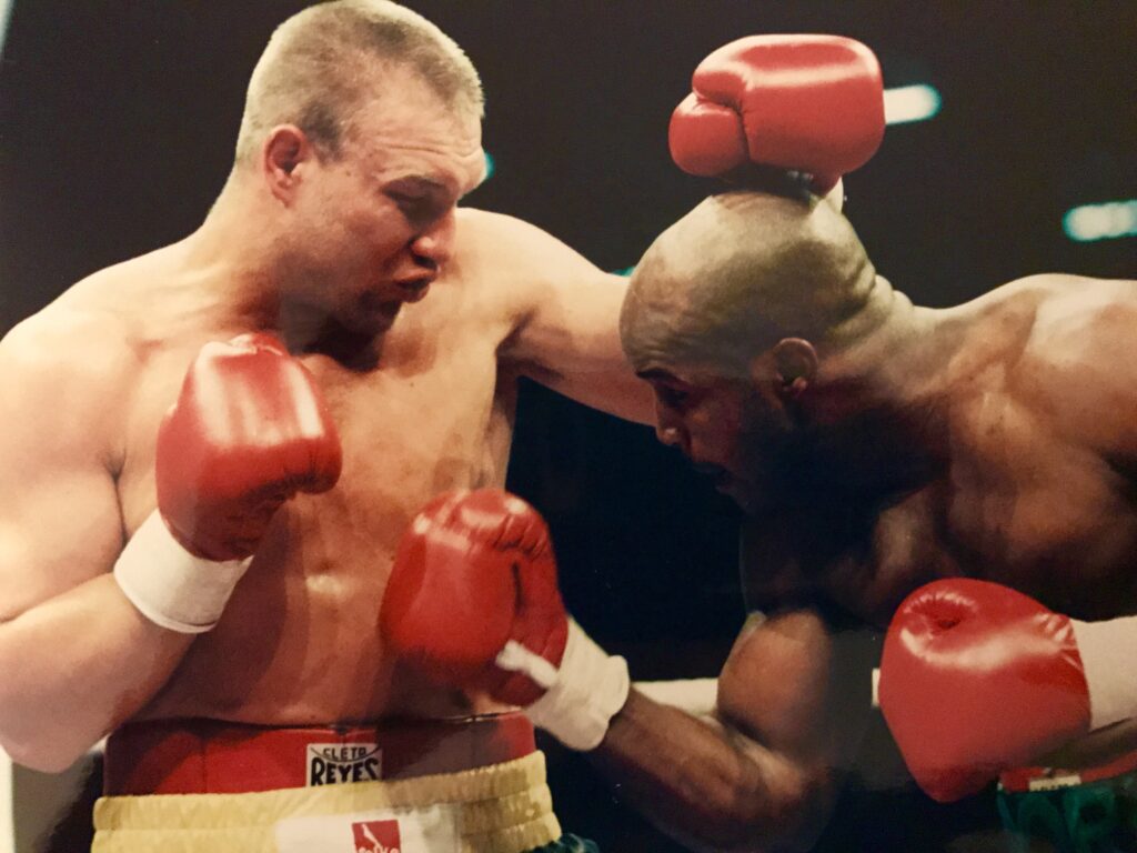 Michael Moorer (R) lands a right to the midsection of Axel Schulz (L) in their bout in Germany for the vacant IBF Heavyweight Title on June 22, 1996, which Moore won by split decision.