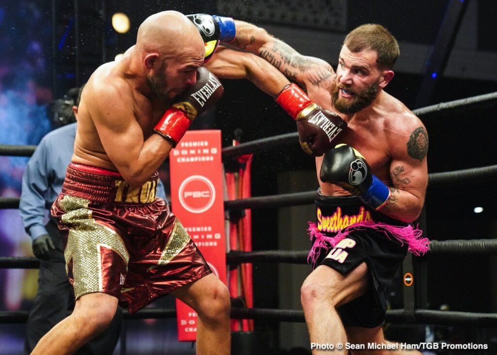 Caleb Plant (R) planting an overhand right to challenger Caleb Taux's head.