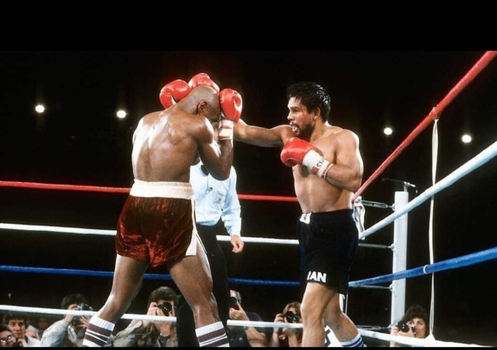 Roberto Duran (R) stabbing Marvelous Marvin Hagler (L) with a hard right.