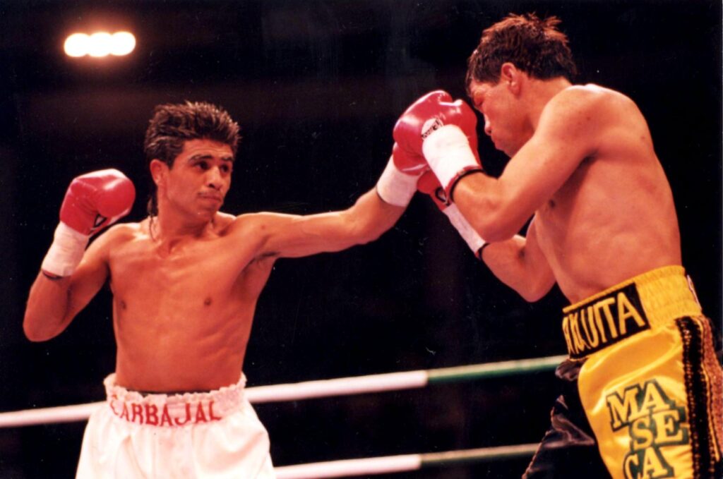 Michael Carbajal (L) KO's Humberto Gonzalez at the Hilton Hotel, Las Vegas, on March 13, 1993 to retain the World Boxing Council (WBC) World Light Fly Title and the International Boxing Federation (IBF) World Light Fly Title. (PHOTO BY ALEX RINALDI)