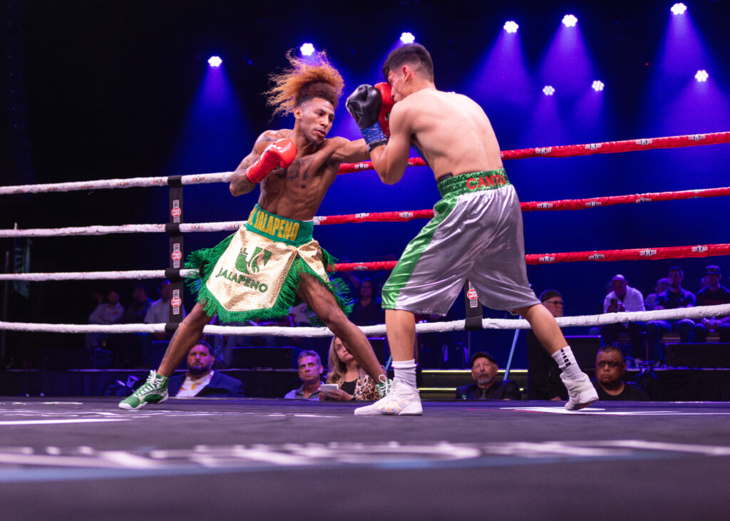 Keon Papillion (L) smashes a terrific left to the jaw of Rondale Hubbert (R).