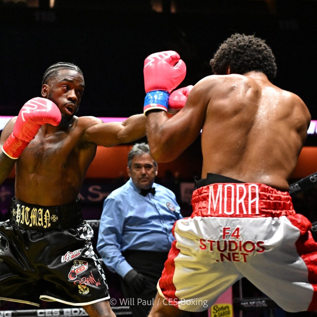 Tevin Regis (L) fires a hard left jab to Anthony Mora's jaw.