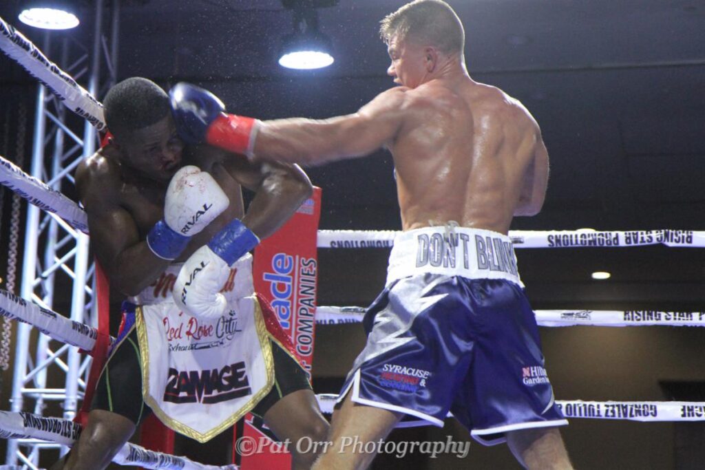 Mills (R) nails Bernadin with a stunning left to the head. (Photo by Pat Orr)