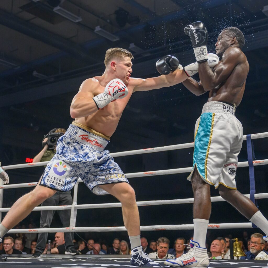Jacob Bank (L) scores with a jarring left to the chin.