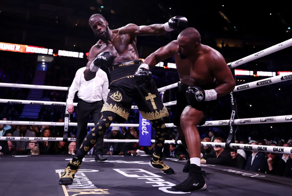 Chisora (R) and Wilder (L) trading blows