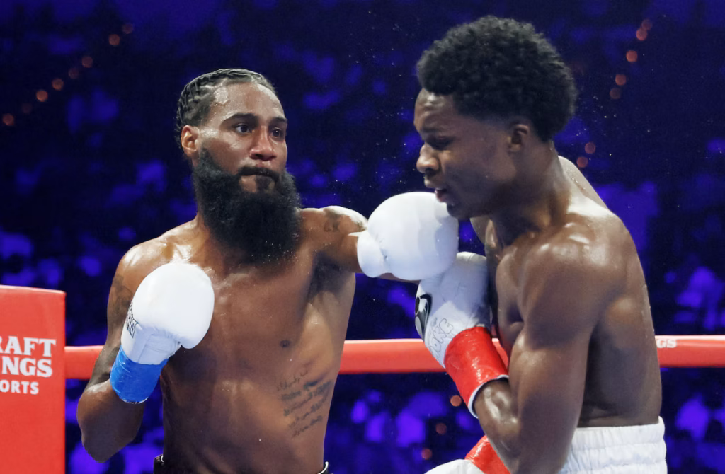 Bell (L) goes on the attack in the early rounds.