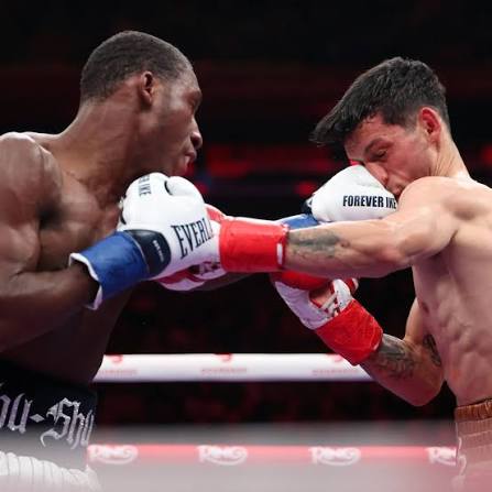 Carrington (L) stabs Palacios (R) with a hard jab to the jaw.