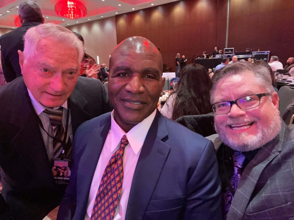 Peter and his father Peter Sr with Evander Holyfield